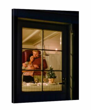Loving couple having dinner in house