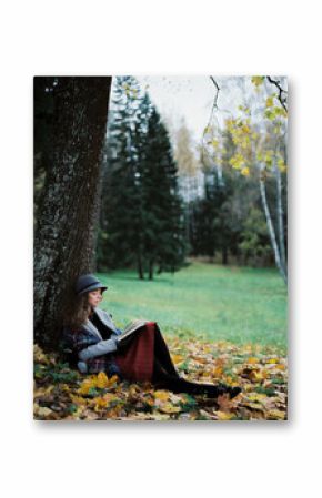 Woman reading book in park