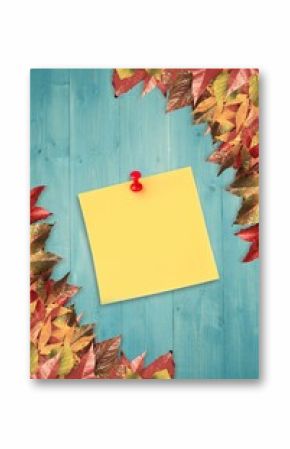 Autumn leaves with yellow note