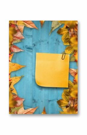 Autumn leaves with yellow note