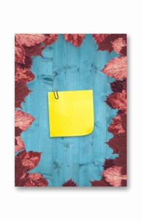 Autumn leaves with yellow note