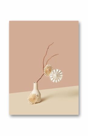 Stylish paper baubles on branch in vase.
