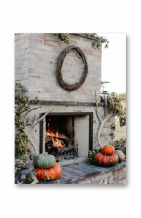 fire crackles in outdoor fall fireplace