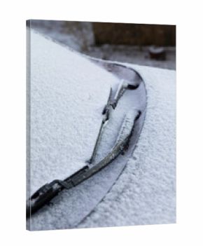 Car Covered in Light snow frost with wiper blades frozen on windscreen