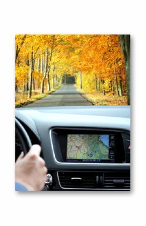 Travel by car with gps in autumnal scenery