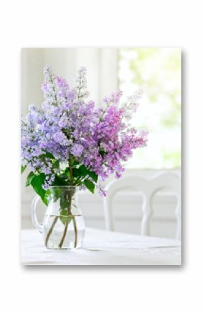 bunch lilac in vase on table