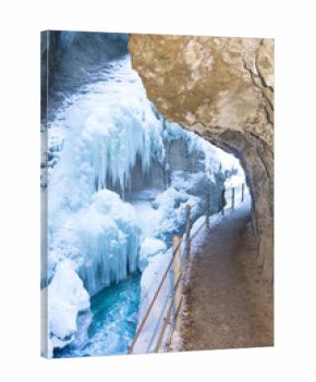 Partnachklamm (Partnach Gorge) with stream, snow-covered rocks and icicles in winter, Garmisch-Partenkirchen, Bavaria, Germany