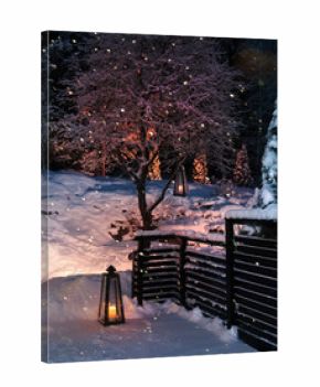 Lanterns in Christmas snowfall garden
