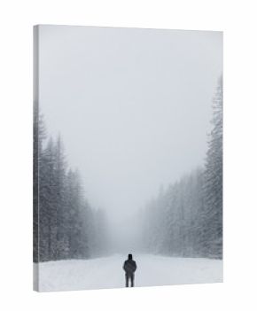 Man on a snow covered backroad