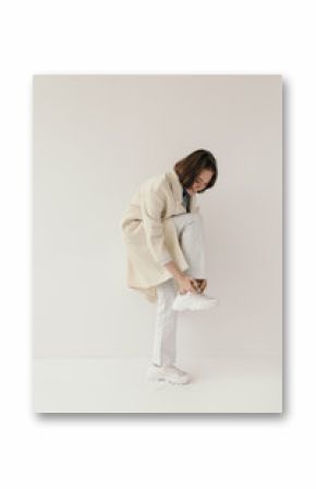 Cheerful model tying laces