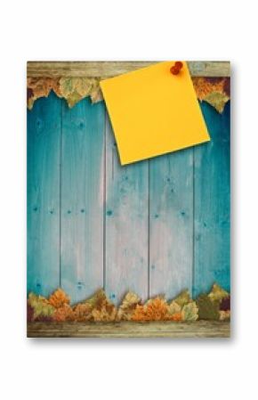 Autumn leaves with yellow note