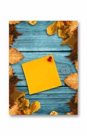 Autumn leaves with yellow note
