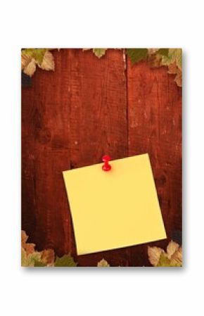 Autumn leaves with yellow note