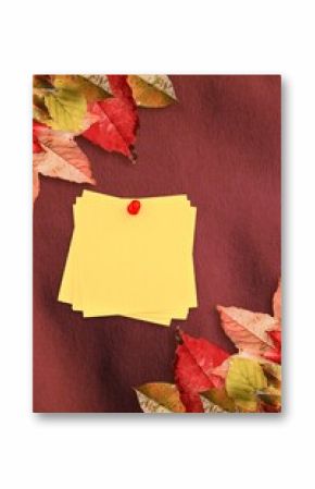 Autumn leaves with yellow note