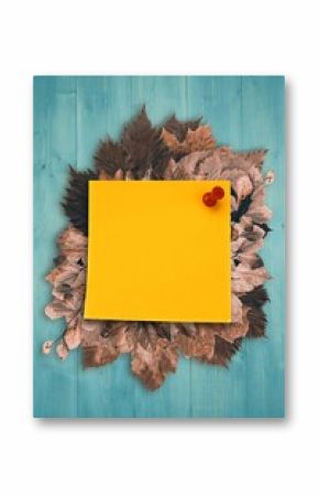 Autumn leaves with yellow note