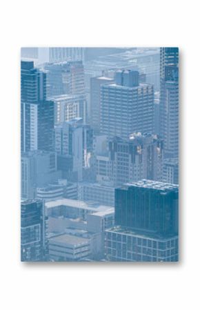 General view of cityscape with multiple modern buildings and skyscrapers in the foggy morning