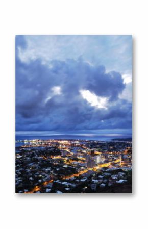 Dark monsoonal clouds hang over the North Queensland port city of Townsville. Queensland, Australia.