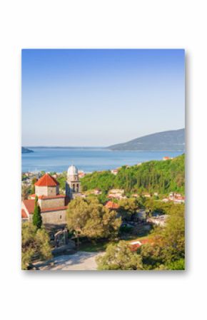 Beautiful city with a church near the sea, top view