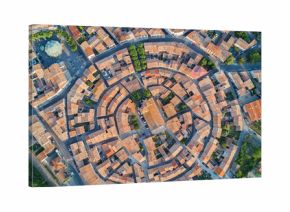 Aerial top view of Bram medieval village architecture and roofs from above, Southern France  