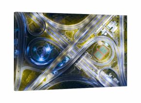 The light on the road roundabout at night and the city in Bangkok, Thailand. Aerial view. Top view. Background scenic road.