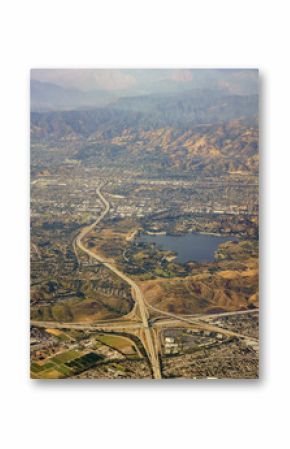 Aerial view of San Dimas and Puddingstone Reservoir, view from window seat in an airplane