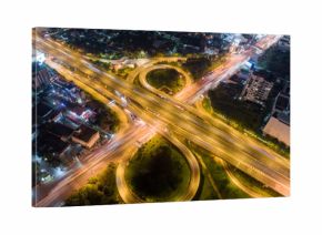 The light on the road roundabout at night and the city in Bangkok.