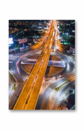 The light on the road roundabout at night and the city in Bangkok, Thailand. Aerial view. Top view. Background scenic road.