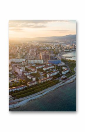Panoramic aerial view of Novorossiysk seafront and port at sunset