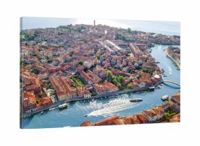 Aerial view of Murano island in Venetian lagoon sea from above, Italy  