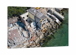 The destroyed house after the earthquake on the seashore