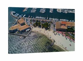 Aerial top view of boats and yachts in marina from above, harbor of Meze town, South France  