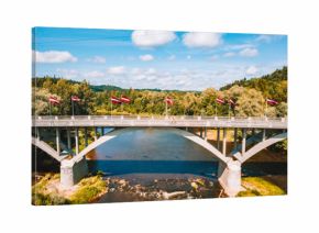 Aerial view of the Sigulda city with Gauja river and a bridge across it with cable car over the valley