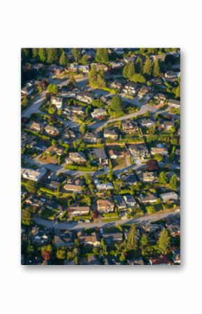Aerial view of the residential homes during a vibrant sunny summer day. Taken in North Vancouver, British Columbia, Canada.