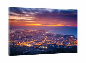 Top view above the city illuminated with lights