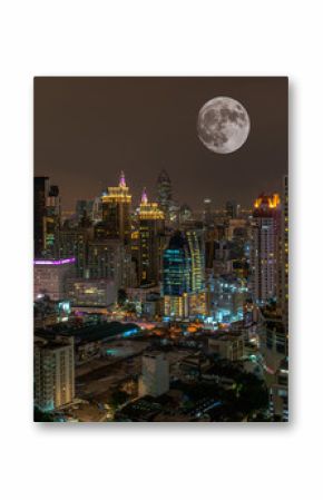 Super full moon above Bangkok city at night , Thailand .