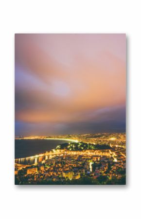 Nightview of the city of Nice, France. The view goes from the foreground with the castle of Nice to the airport in the background.