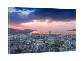 Beautiful aerial view of Patong beach over city in sunset sky.