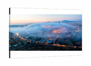Early morning fog over the rising city of Queretaro Mexico. The aqueduct of Queretaro, is currently building a monumental seventy four arches reaching an average height of twenty eight meters. 