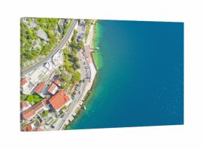 Top view of a beautiful city with red roofs near the sea