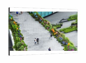 top aerial view people are walking on the bridge pedestrian hardscape and landscape green area garden walkway in the business city area.