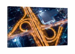The light on the road roundabout at night and the city in Bangkok.