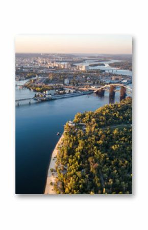 Aerial top view of Kyiv skyline, Dnieper river and Truchaniv island from above, sunset in Kiev city, Ukraine  