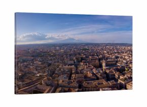 Beautiful aerial view of the Catania city on Sicily from above with Etna volcano visible on the horizon.