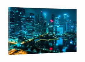 Aerial drone view of Singapore skyscrapers with city skyline at night