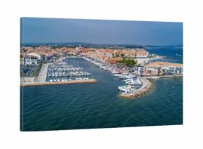 Aerial top view of boats and yachts in marina from above, harbor of Meze town, South France  