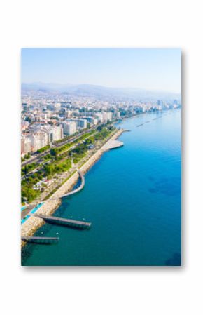 Aerial view of Molos Promenade park on coast of Limassol city centre,Cyprus. Bird's eye view of the jetty, beachfront walk path, palm trees, Mediterranean sea, piers, urban skyline and port from above