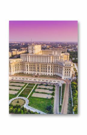 Parliament building or People's House in Bucharest city. Aerial view at sunset with abstract pink sky