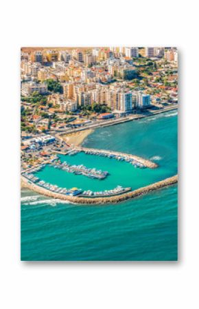 Sea port city of Larnaca, Cyprus.  View from the aircraft to the coastline, beaches, seaport and the architecture of the city of  Larnaca.