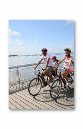 Family on a biking journey by the sea