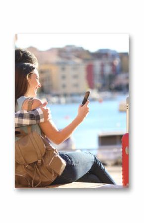Couple of tourists searching on a smart phone